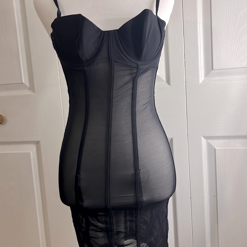 One piece sheer lingerie with attached garter straps